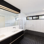 this master ensuite is spacious, light and functional with clean lines and attention to detail