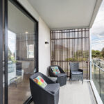 the front balcony provides a relaxing place to sit, socialise and enjoy the views with the timber screen providing privacy