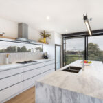 the stunning marble benchtop is the highlight of this kitchen