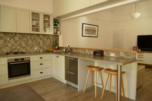 Tiled kitchen with wooden chair